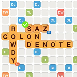 WWF game with the words colon, rowdy, and denote played on the board. The word &quot;saz&quot; is added on the board, also forming the words &quot;sod&quot; and &quot;ane&quot;, showing an example of creating compound words.